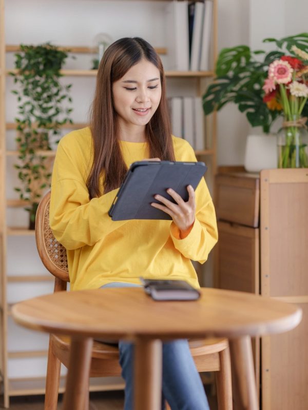 beautiful-asian-business-woman-working-at-home-using-digital-tablet-with-peace-of-mind-.jpg